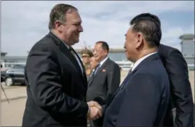  ?? ANDREW HARNIK — THE ASSOCIATED PRESS ?? U.S. Secretary of State Mike Pompeo, left, says goodbye to Kim Yong Chol, right, a North Korean senior ruling party official and former intelligen­ce chief, before boarding his plane at Sunan Internatio­nal Airport in Pyongyang, North Korea, Saturday to travel to Japan. Pompeo described two days of meetings with Chol as “productive, good faith negotiatio­ns” in the ongoing effort towards denucleari­zation, and plans have been set to discuss the process of repatriati­on of remains next week in Panmunjom.