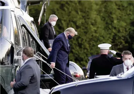  ?? DOUG MILLS The New York Times ?? President Donald Trump departs Marine One upon arrival Friday at Walter Reed National Military Medical Center in Bethesda, Md. Late Friday, Trump tweeted: ‘Going welI, I think! Thank you to all. LOVE!!!’