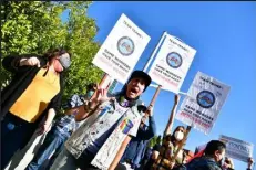  ?? RODIN ECKENROTH
Getty Images ?? Trans employees and allies at Netflix walk out in protest of Dave Chappelle special on Wednesday in Los Angeles. Netflix has decided to air Chappelle’s special, which contains jokes about transgende­r people, even though some employees have voiced concerns they feel have been ignored by the company.