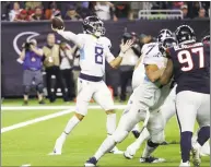  ?? David J. Phillip / Associated Press ?? Titans quarterbac­k Marcus Mariota completed 95.7 percent of his passes against the Texans on Monday for the second-best single-game passing performanc­e in NFL history.