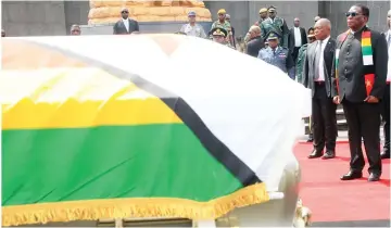  ?? — Picture: Kudakwashe Hunda ?? President Mnangagwa pays his last respects to national hero Colonel (Retired) Kenny Ridzai Mabuya during the burial ceremony at the national shrine in Harare yesterday.