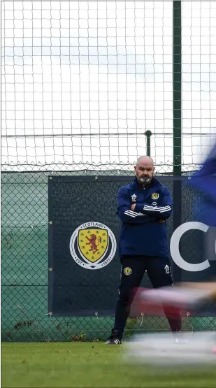  ??  ?? Steve Clarke runs the rule over his Scotland men in Alicante, where John Fleck (left) was made to isolate with Covid-19