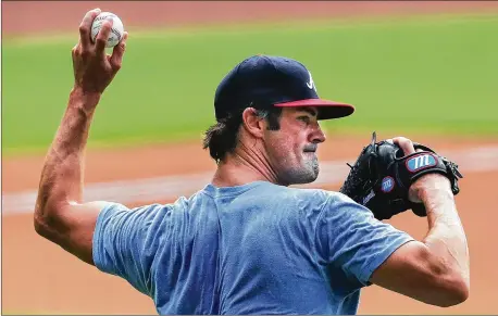  ?? CURTIS COMPTON / CCOMPTON@AJC.COM ?? Braves pitcher Cole Hamels gets in some work from the mound July 3 during the first workout of summer camp at Truist Park. Hamels, acquired in the offseason, has yet to play a game with Atlanta, but that could change in the coming weeks.