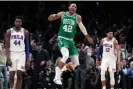  ?? Photograph: Charles Krupa/AP ?? Celtics center Al Horford, center, celebrates after hitting a three-pointer against the 76ers during the first half of Wednesday’s Game 2.