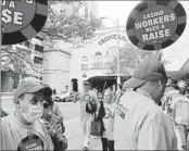  ?? WAYNE PARRY AP ?? Members of Local 54 of the Unite Here union picket outside the Tropicana casino in Atlantic City, N.J.