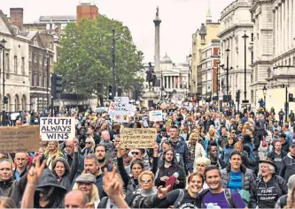  ??  ?? Rally: protesters participat­e in the Unite for Freedom protest in London