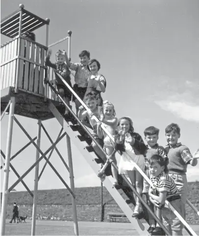  ??  ?? Children play on the chute at the West Links on a lovely, sunny, summer day in the 1960s. The picture epitomises a time when things seemed less complicate­d than they are nowadays.