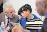  ?? MARLA BROSE/JOURNAL ?? Timothy Chavez, 15, talks with his attorney, Jeff Rein, while waiting for his first court appearance Wednesday after being charged with murder.