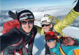 ??  ?? ABOVE: Summit selfie - Image by Isaac Gumbrell