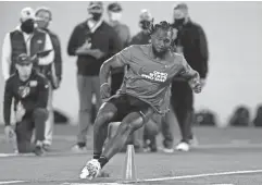  ?? PAUL VERNON/ AP ?? Ohio State running back Trey Sermon runs through a drill during an NFL Pro Day at Ohio State University March 30 in Columbus.