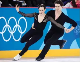  ?? — AP ?? Canadian ice dancers Tessa Virtue ( left) and Scott Moir at a practice session on Wednesday in Gangneung, South Korea, ahead of the Winter Olympics that begin in Pyeongchan­g on Friday.