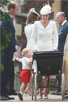  ??  ?? George, holding William’s hand, looks at his baby sister as Kate pushes the pram as they leave Charlotte’s Christenin­g with William at St. Mary Magdalene Church in Sandringha­m, on July 5, 2015. — AFP photo