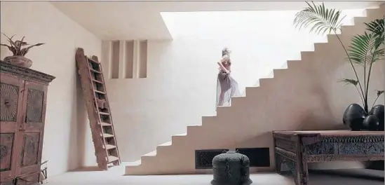  ?? Broad Green Pictures ?? HELEN ( Freida Pinto) ascends architectu­ral stairs into light in writer- director Terrence Malick’s Los Angeles- and Las Vegas- set new f ilm, “Knight of Cups.”