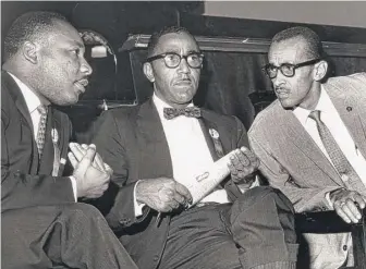  ?? | CARL LYNN/ RICHMOND TIMES- DISPATCH VIA AP ?? The Rev. Wyatt TeeWalker ( right) meets with the Rev. Martin Luther King Jr. ( left) and Joseph E. Lowery about the SCLC convention in Richmond, Virginia, on Sept. 25, 1963.