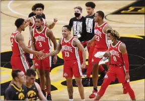  ?? REBECCA F. MILLER — THE ASSOCIATED PRESS ?? Ohio State players celebrate their win against Iowa in Iowa City, Iowa on Feb. 4.