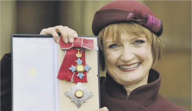  ?? PICTURE: JOHN STILLWELL/PA ?? 0 Former Cabinet Minister Dame Tessa Jowell shows off her Dame Commander insignia after it was presented by the Prince of Wales in 2013