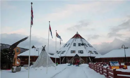  ??  ?? Children play in front of the Arran, the Lule Sami multi-activity centre, in Tysfjord municipali­ty. Photograph: Tore Meek/AFP/ Getty Images