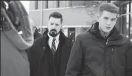  ?? STACEY WESCOTT/CHICAGO TRIBUNE ?? Former Schaumburg police officer John Cichy, center, leaves the DuPage County courthouse on Feb. 13 in Wheaton, Ill. Five years ago he was accused of taking part in a scheme to steal and sell drugs, but charges against him were recently dropped.