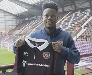  ??  ?? Full-backs Ashley Smithbrown, above, and Michael Smith show off their new colours at Tynecastle yesterday.