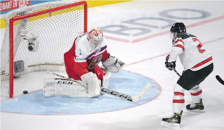  ?? — THE CANADIAN PRESS ?? Team Canada defenceman Blake Speers scores on Czech Republic goaltender Jakub Skarek during the world juniors quarter-final in Montreal on Monday.