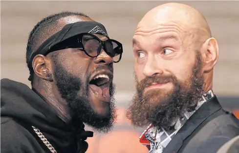  ?? AP ?? Deontay Wilder, left, and Tyson Fury exchange words as they face each other at a news conference in Los Angeles.