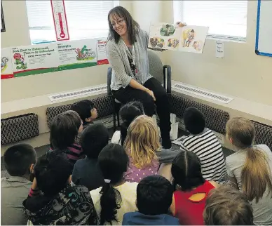  ?? LARRY WONG FILE ?? Pam Schenk, a Grade Two teacher at Jackson Heights School in Edmonton, reads to her class. School trustees would like to see more funding, longer funding, and better support for teaching English language learners in schools.