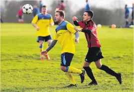  ??  ?? St Andrews’ Connor Trotman comes under pressure from Lion’s Josh Armstrong during the Downs League Division Two game last Saturday