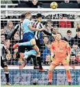  ??  ?? Head of queue: Steve Cook leaps to score the injury-time winner for Bournemout­h