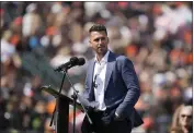  ?? TONY AVELAR — THE ASSOCIATED PRESS ?? Former San Francisco Giants catcher Buster Posey speaks during a ceremony to honor his career, before the team's game against the St. Louis Cardinals on Saturday in San Francisco.