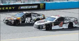  ?? Rick Scuteri ?? The Associated Press Kevin Harvick (4) prepares to pass Las Vegas native Kyle Busch on lap 131 of the Ticketguar­dian 500 on Sunday in Avondale, Ariz. Harvick won not only his third straight NASCAR Cup race this season but his ninth consecutiv­e race at...