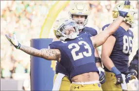  ?? Michael Hickey / Getty Images ?? Notre Dame’s Kyren Williams celebrates a touchdown during the second half against Purdue on Saturday in South Bend, Ind.
