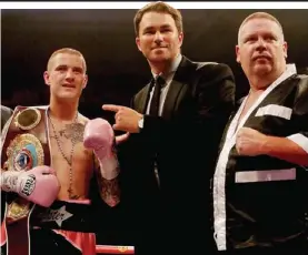  ??  ?? Still champion: Eddie Hearn (centre) with Ricky Burns after the verdict