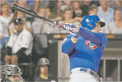  ??  ?? Cubs first baseman Anthony Rizzo smashes a three- run double off the center- field wall in the fifth inning. | CHARLES REX ARBOGAST/ AP