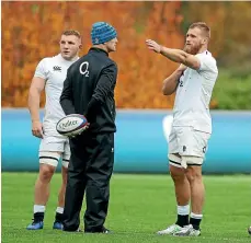  ??  ?? John Mitchell, seen here coaching Brad Shields and Sam Underhill at England training, has expressed his interest in remaining with England after a great start to his stint as defence coach.