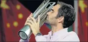  ?? Picture: REUTERS ?? UNRATTLED PLAY: Roger Federer of Switzerlan­d kisses the trophy after winning the Shangai Masters yesterday against world number one Rafael Nadal, of Spain, at the Qizhong Tennis Centre. Federer is a 19-time Grand Slam champion