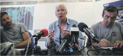  ??  ?? Actor Richard Gere gestures as he speaks during a press conference he held along with Open Arms founder Oscar Camps, in the island of Lampedusa yesterday
Photo: Valerio Nicolosi/AP