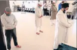  ?? SOURCED PHOTO ?? Maulana Khalid Rasheed Firangi Mahali (R) offering the Jumatul-Wida prayers at a mosque in Lucknow on Friday.