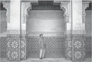  ?? MOSA’AB ELSHAMY/AP ?? A tourist in Marrakech admires the columns of Ben Youssef Madrasa, Morocco’s largest traditiona­l Islamic school, founded in the 14th century.