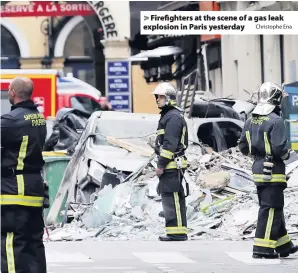  ?? Christophe Ena ?? &gt; Firefighte­rs at the scene of a gas leak explosion in Paris yesterday