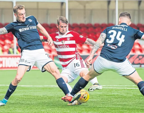  ??  ?? Kevin Holt, left, and Kerr Waddell combine to thwart David Templeton during the Dark Blues’ 3-0 defeat at Hamilton last August. SNS.