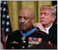  ?? (AP/Manuel Balce Ceneta) ?? Then-President Donald Trump presents the Medal of Honor to retired U.S. Marine Corps Sgt. Maj. John Canley in October 2018 during an East Room ceremony at the White House. Canley, who
was born in Caledonia and grew up in El Dorado, died Wednesday.