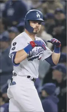  ?? Robert Gauthier Los Angeles Times ?? GAVIN LUX celebrates after hitting a single during the second inning. Lux reached base in all four of his plate appearance­s.