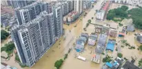  ?? — AFP ?? A view of flooded buildings and streets after heavy rains in Qingyuan city, China.
