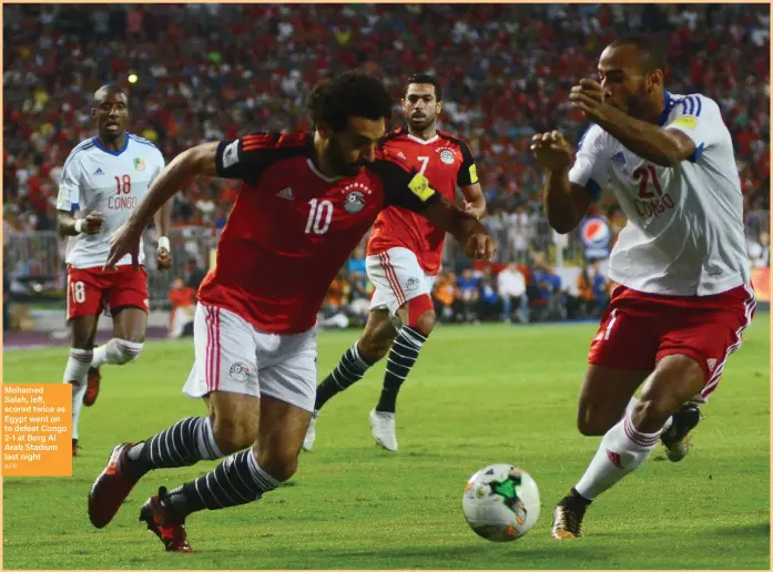  ??  ?? Mohamed Salah, left, scored twice as Egypt went on to defeat Congo 2-1 at Borg Al Arab Stadium last night AFP