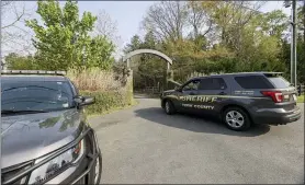  ?? NELL REDMOND — THE ASSOCIATED PRESS ?? A York County sheriff vehicle drives onto the property on Thursday where multiple people, including a prominent doctor, were fatally shot a day earlier, in Rock Hill, S.C. A source briefed on the mass killing said the gunman was former NFL player Phillip Adams, who shot himself to death early Thursday.