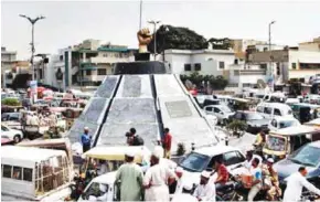  ?? - Express Tribune ?? CRACKDOWN: All pictures of Altaf Hussain have been removed from Azizabad’s famous Mukka Chowk, which has been renamed Liaquat Ali Khan Chowk.