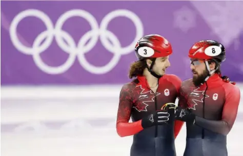  ??  ?? Samuel Girard and Charles Hamelin, after winning bronze in the men’s 5,000 metres in Pyeongchan­g. Leah Hennel