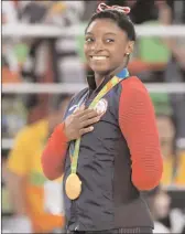  ?? Photo by Jonathan Newton / The Washington Post ?? Simone Biles rebounded from a disappoint­ing bronze medal in the balance beam with a gold-medal effort in the floor exercise Tuesday afternoon. .