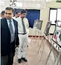  ??  ?? Picture shows Chief Guest AVM Tilan de Silva, Dharmasoka College Principal Hasitha Wettimuni and Past Pupils Associatio­n Colombo Chapter President Chandralal Sooriyaara­chchi viewing the exhibits.