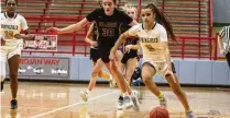  ?? JEFF GILBERT / CONTRIBUTE­D ?? Milly Portis attacks the Bellbrook defense during Springfiel­ds’s tournament victory Wednesday. The Wildcats will play in a sectional final for the first time since the merger.